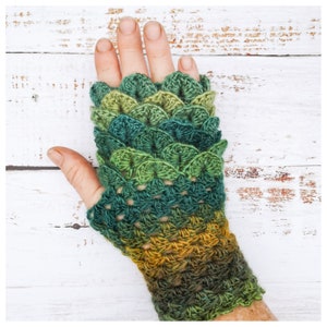 May include: Green, yellow, and brown crocheted fingerless gloves with a scale pattern.