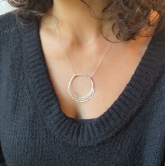 The Infinity Circle Hammered Silver Necklace With Blue Topaz Gemstones -  Magda Molina Designs