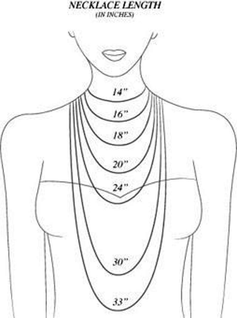 May include: A black and white line drawing illustration showing a torso with multiple concentric necklace chains. The text NECKLACE LENGTH (IN INCHES) appears at the top. The chains are labelled with lengths of 14, 16, 18, 20, 24, 30, and 33 inches.