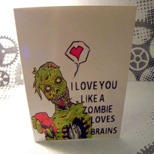 I love you like a zombie loves brains Greeting Card