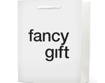 May include: White paper gift bag with black text that reads "fancy gift".