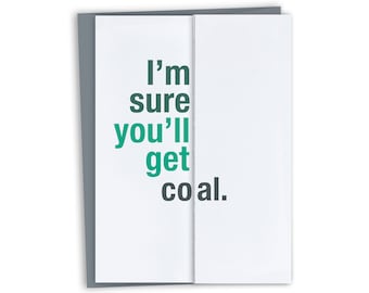 May include: A white card with a green and black text message that reads "I'm sure you'll get coal."