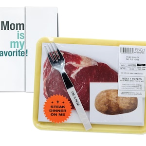 May include: A yellow styrofoam tray with a steak, potato, and a fork. The tray has a sticker that says "Steak Dinner On Me" and another sticker that says "I'm a Pen!" The tray also has a label that says "Prime Quality Day Old Jokes".