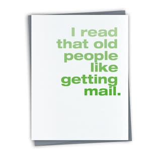 May include: A white greeting card with the text "I read that old people like getting mail" in green. The card is on a gray background.