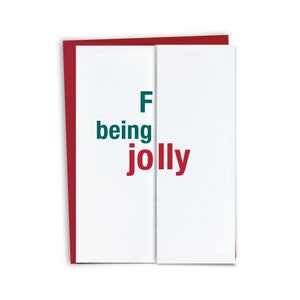 Puede incluir: Una tarjeta blanca con texto rojo y verde que dice "F being jolly". La tarjeta est&aacute; doblada por la mitad y tiene un borde rojo.