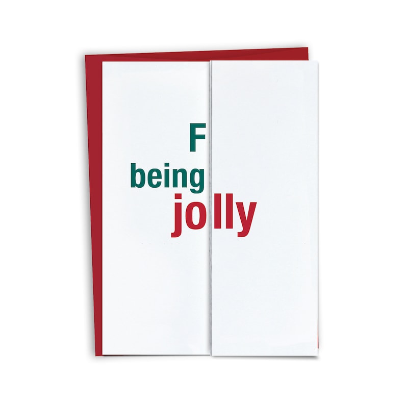 Puede incluir: Una tarjeta blanca con texto rojo y verde que dice "F being jolly". La tarjeta est&aacute; doblada por la mitad y tiene un borde rojo.