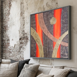 a cozy living room with a large window overlooking a cityscape. The room is furnished with a gray sofa, a wooden coffee table, and a large abstract painting on the wall.