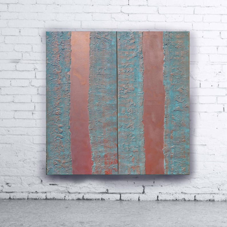 a large, abstract painting with vertical stripes in shades of blue and red, displayed on a white brick wall.