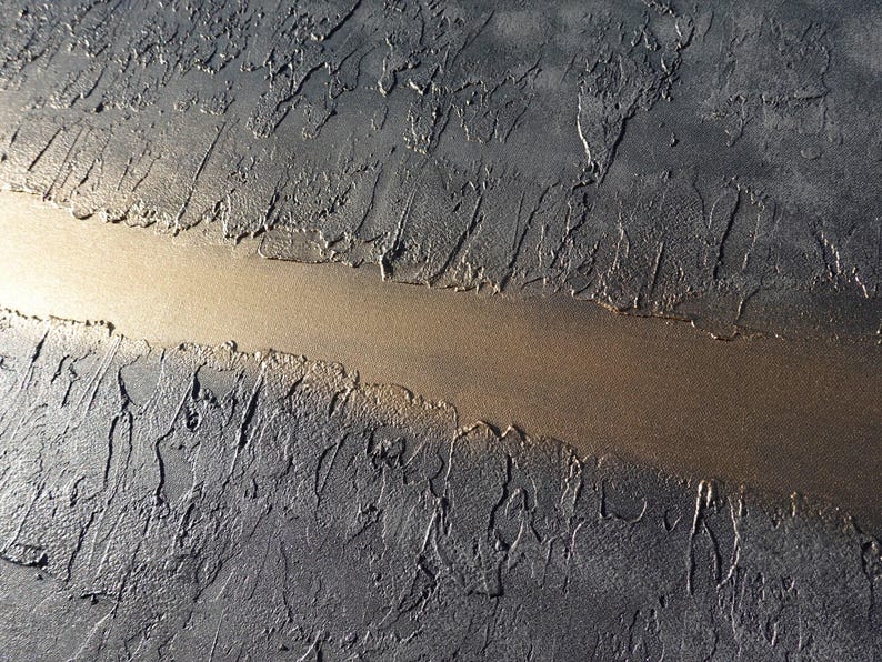 a close-up view of a textured surface with a long, narrow line running through it, creating a sense of depth and movement.