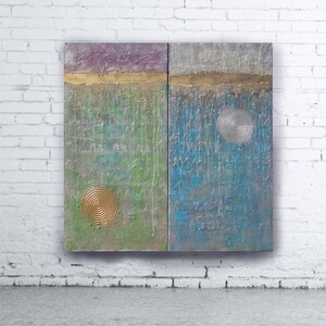The image is a modern art piece featuring two abstract paintings hanging on a white brick wall.