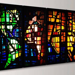 The image is a vibrant display of stained glass windows, each with a unique pattern and color scheme. The windows are arranged in a row, creating a visually striking and intricate composition.