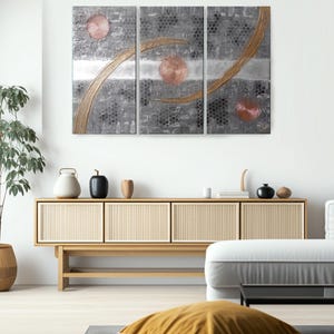 a modern living room with a large abstract painting on the wall, a wooden cabinet, and a comfortable seating area with a yellow pillow.