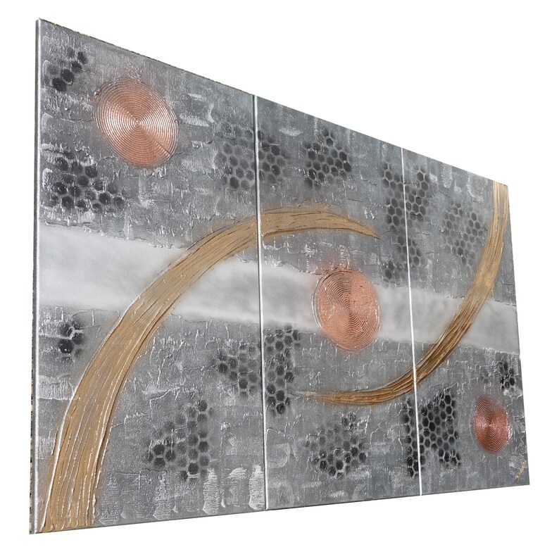 The image is a large, abstract artwork composed of various shapes and textures, including circles, lines, and other geometric forms. The artwork is displayed on a white background, which highlights the colors and patterns within the piece.