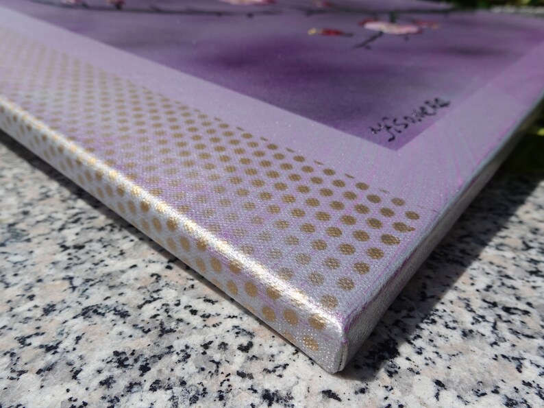 May include: Close-up of the edge of a canvas painting with a purple background and a gold polka dot pattern. The painting is signed "J.S.Vance".