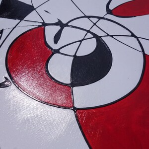 The image is an abstract painting with bold red and black colors, featuring a mix of geometric shapes and lines.