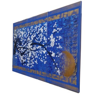 The image is a large, colorful painting depicting a tree with white flowers against a blue background.