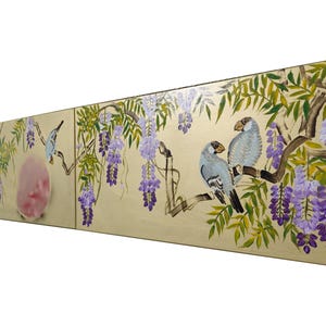 A painting depicting a group of birds perched on branches with purple flowers, creating a serene and natural scene.