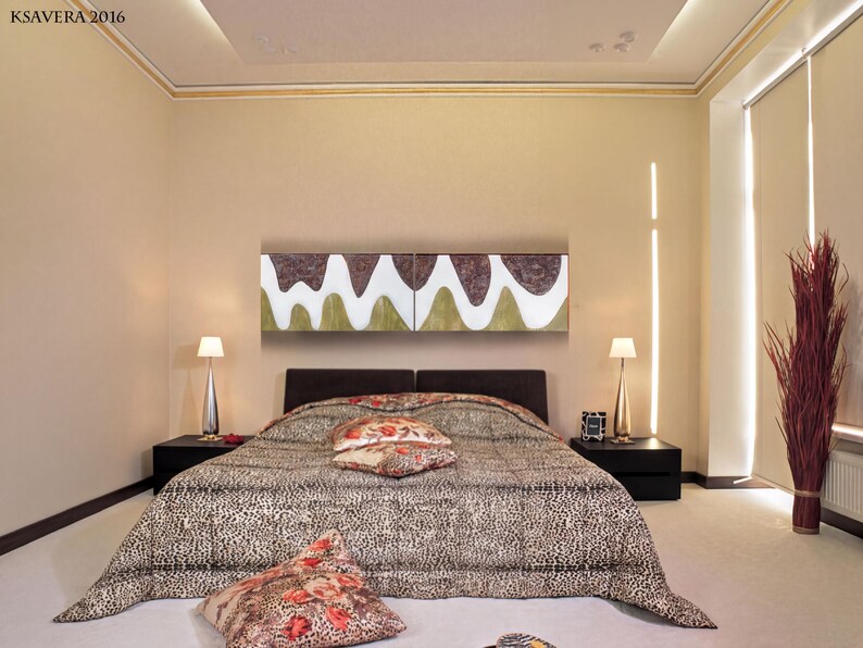 a modern bedroom with a large bed, a nightstand, and a large abstract painting on the wall.