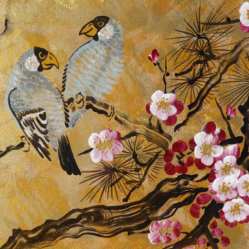 The image is a painting featuring two birds perched on branches with flowers. The painting has a warm, golden-brown background and is adorned with delicate pink and white flowers.