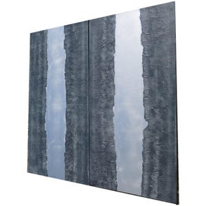The image is a large, three-panel artwork with a textured, dark gray background. The panels are arranged in a vertical orientation, creating a sense of depth and dimension. The artwork does not contain any discernible text or specific objects, and the overall composition is minimalistic and focused on the texture and color of the panels.