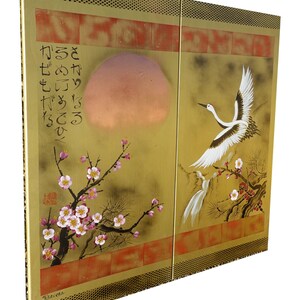 The image is a painting featuring a crane and cherry blossoms, with a large sun in the background.