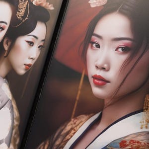 The image is a close-up of two portraits of women wearing traditional Japanese kimonos. The women have dark hair and are wearing gold earrings and red lipstick. The background is blurred, drawing attention to the women in the foreground.