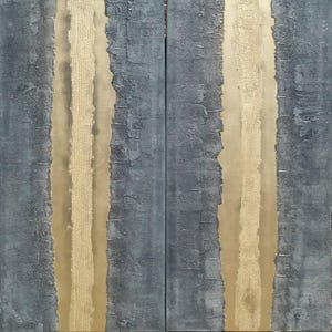 a close-up view of a textured surface with vertical lines and a metallic gold element running through the center.