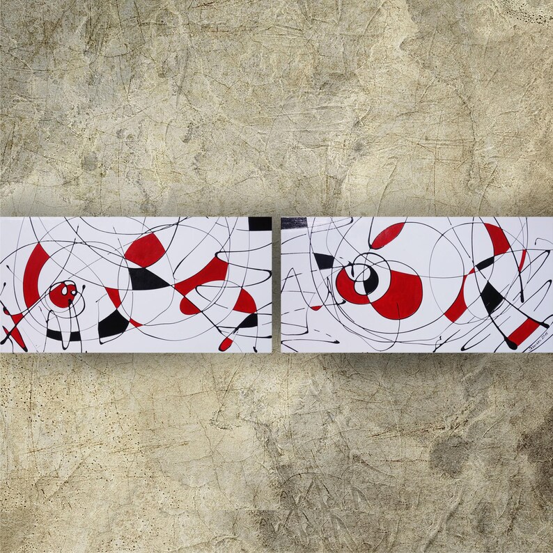 abstract art with bold red and black lines and shapes on a white background.