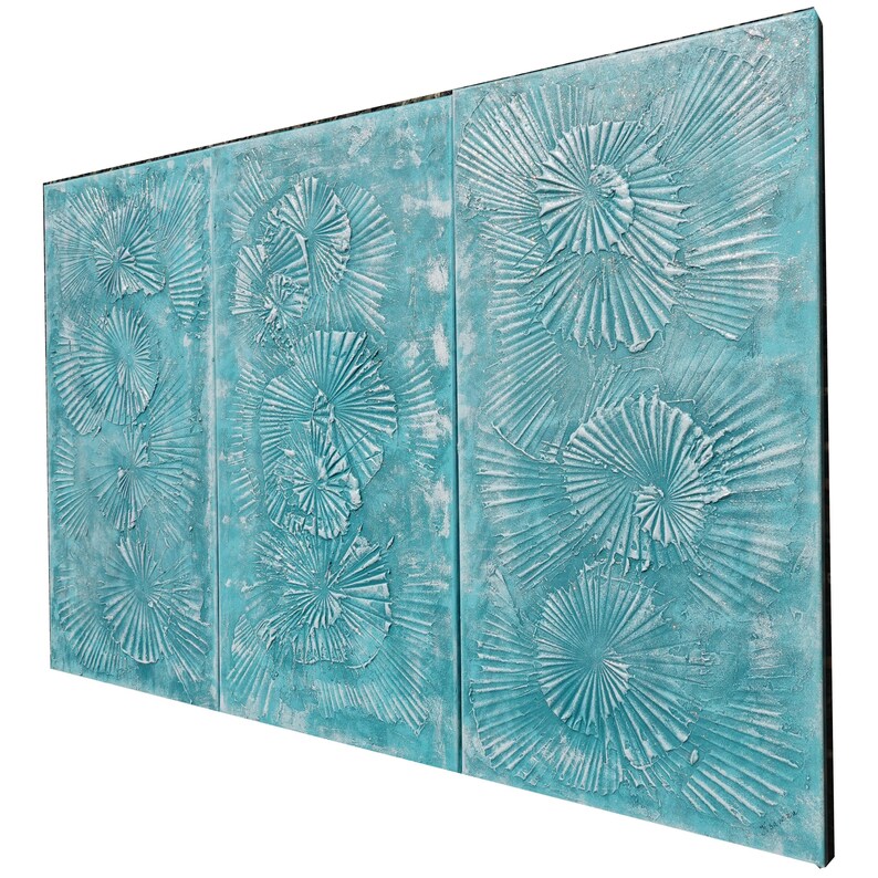 The image is a triptych of three paintings, each featuring a blue background with white floral designs. The paintings are arranged in a row, creating a visually appealing and harmonious display.