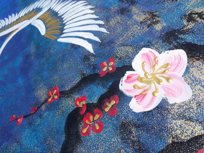 The image is a close-up of a painting featuring a pink flower with gold accents, surrounded by red flowers and a bird-like design in the background.