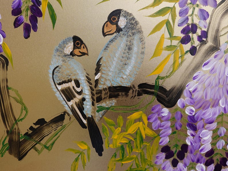 two birds perched on a branch, surrounded by a lush, colorful backdrop of purple flowers and green leaves.