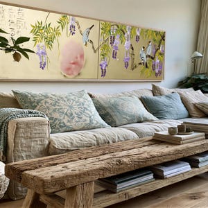 a cozy living room with a large window, a comfortable sofa, a wooden coffee table, and various decorative elements such as potted plants and books.