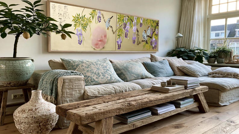 a cozy living room with a large window, a comfortable sofa, a wooden coffee table, and various decorative elements such as potted plants and books.
