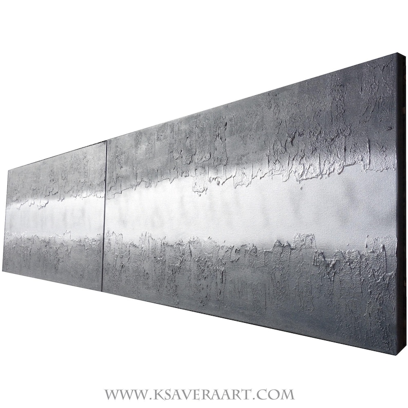 The image is a large, rectangular, metallic surface with a textured, metallic appearance. It is set against a white background, which highlights its metallic properties. The image does not contain any discernible text or other objects, and it is not a collage of multiple images. The image is a single, continuous piece of artwork.