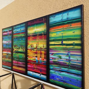 a vibrant, abstract painting with bold, colorful brushstrokes arranged in a grid-like pattern.