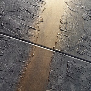 a close-up view of a textured surface with a diagonal line running through it, creating a sense of movement and depth.