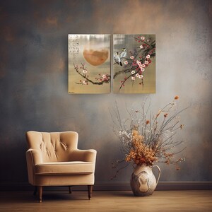 a cozy living room with a beige armchair, a vase of dried flowers, and a painting of a bird perched on a branch with flowers.