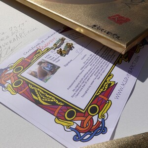 a certificate of authenticity for a painting, with a colorful frame and a website address.