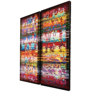 two large, colorful paintings with vibrant stripes and patterns. The paintings are displayed side by side, creating a striking visual contrast.