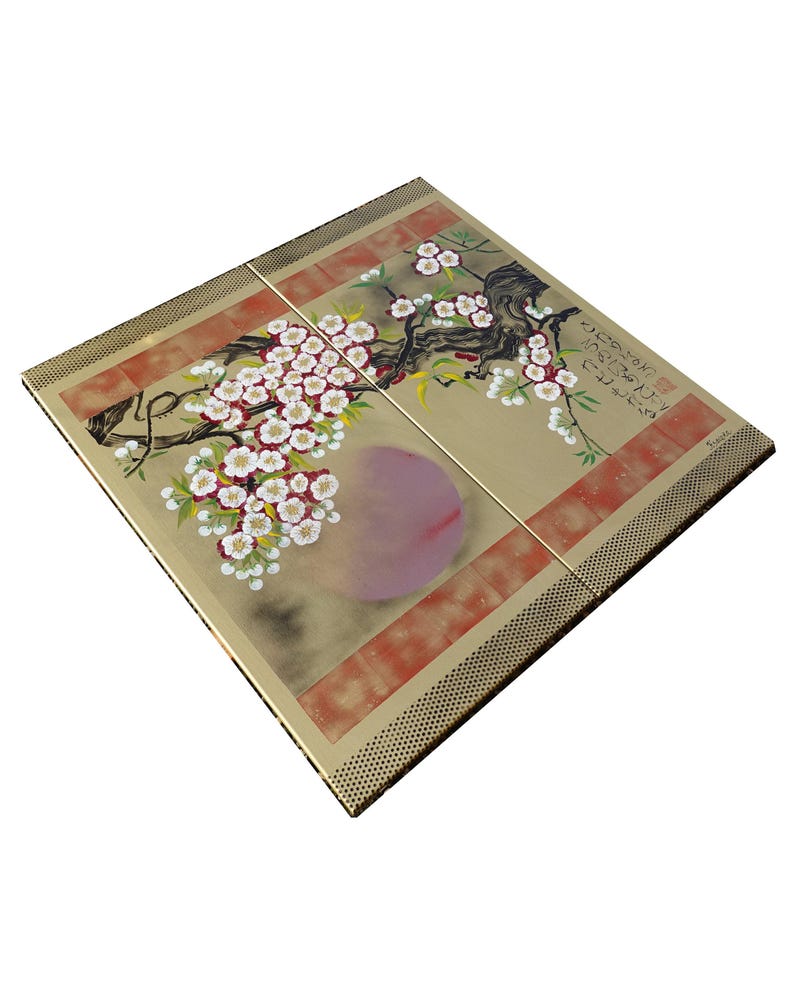 a square-shaped piece of art with a floral design, including a tree with pink flowers and a large pink flower.