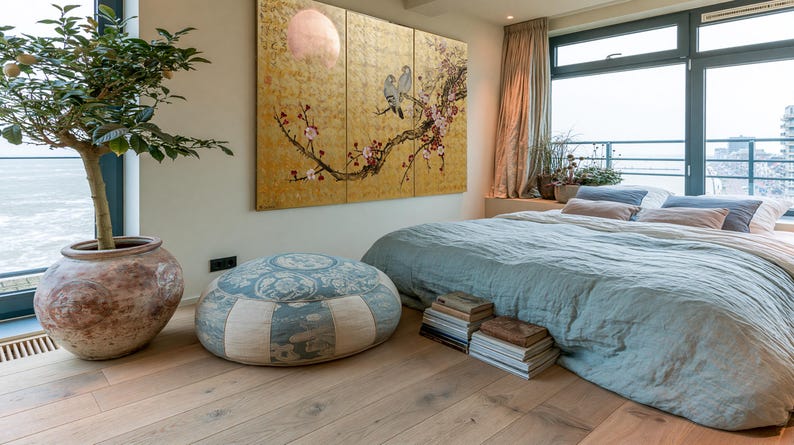 a serene and cozy bedroom with a large bed, a potted plant, and a large window overlooking the ocean. The room has a warm and inviting atmosphere, with a wooden floor and a large painting on the wall.