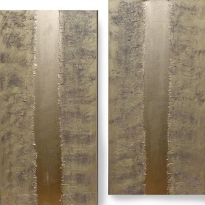 two abstract paintings with a textured, metallic appearance. The paintings are vertical in nature, with a thin, horizontal line running through the center, creating a sense of balance and symmetry. The overall color palette is muted, with shades of brown and gray dominating the composition.