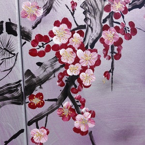 May include: A painting of a pink and red cherry blossom branch with black brushstrokes on a purple background.