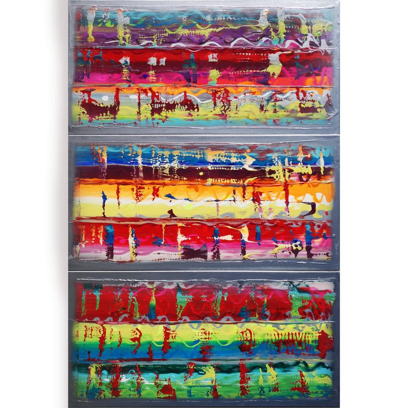 The image is a vibrant, abstract painting composed of three panels, each with a unique color scheme and pattern. The panels are arranged in a vertical format, creating a sense of depth and dimension. The colors used are bold and varied, with shades of red, yellow, green, blue, and purple creating a visually striking and dynamic composition.