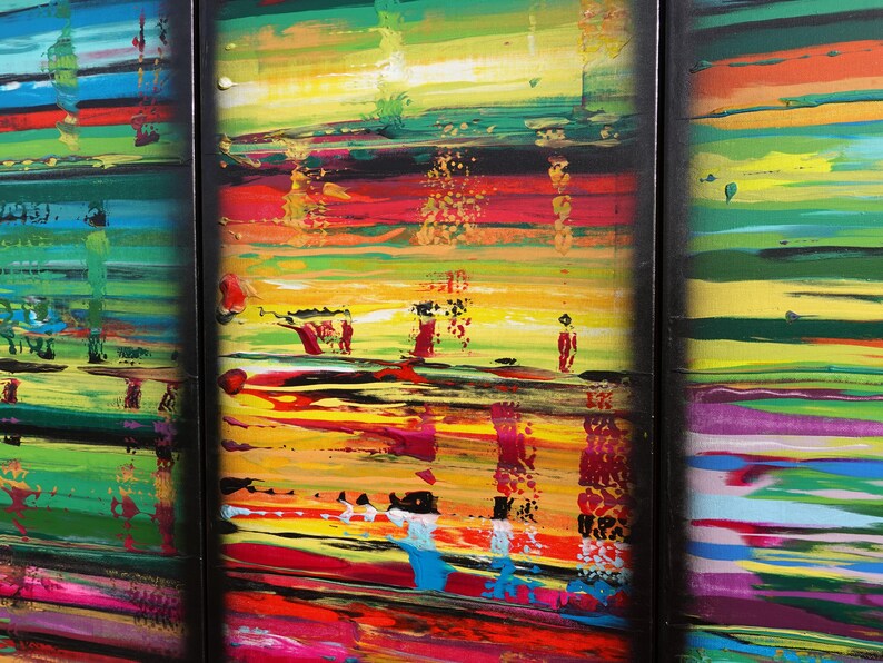 The image is a vibrant, abstract painting with bold colors and dynamic brushstrokes. The painting is divided into three panels, each showcasing a different section of the artwork. The panels feature a mix of warm and cool colors, creating a visually striking and energetic composition. The painting is a captivating display of abstract art, with the artist's use of color and brushwork bringing the scene to life.
