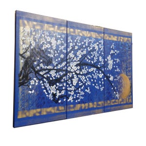 A large, colorful painting depicting a tree with white flowers against a blue background.