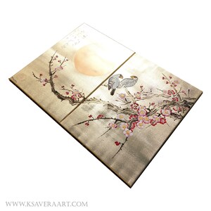 The image is a two-panel artwork featuring a pair of birds perched on branches with pink and white flowers. The artwork is set against a pale background, which highlights the intricate details of the birds and flowers.