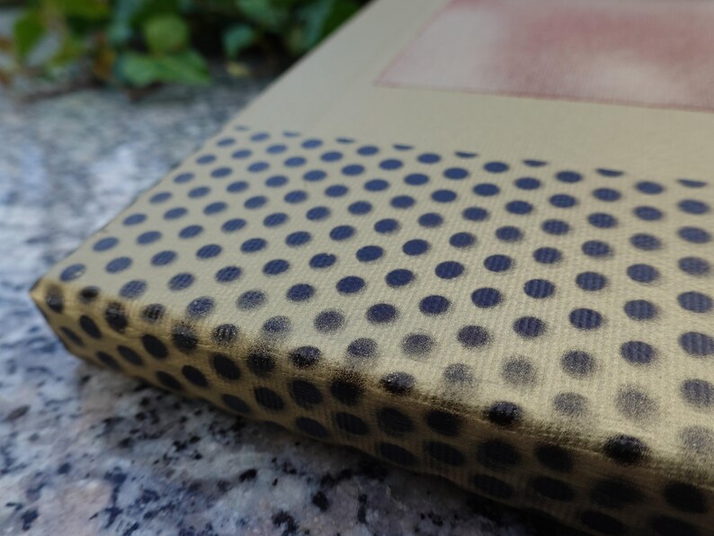 a close-up view of a surface with a pattern of black and white polka dots.