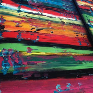 The image is a vibrant, abstract painting with bold, colorful brushstrokes and a sense of movement across the canvas.