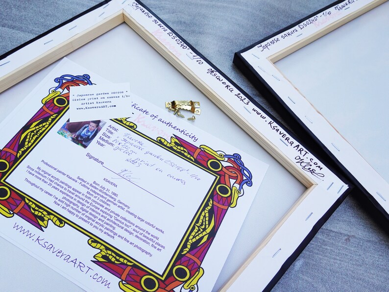 May include: A certificate of authenticity for a Japanese garden painting titled "Japanese Sakura DS0240". The certificate is printed on a white background with a colorful border. The certificate includes the artist's name, title, size, medium, and year. The artist's signature is also included. The certificate is framed in a black and wood frame.